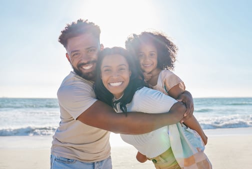 beach-vacation-portrait-happy-family-with-child-excited-sea-ocean-holiday-together-happiness-water-father-young-mother-playing-piggyback-with-kid-summer-trip