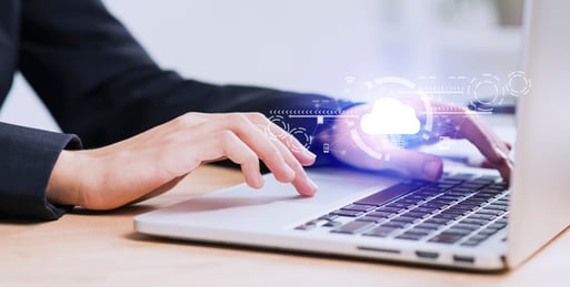 person on laptop with image of cloud