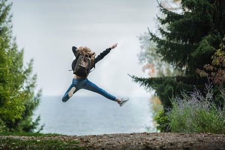 person jumping in the air excited